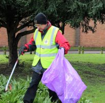 Lion President Martin collecting rubbish