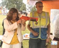 The Mayor takes aim on the paintball stand